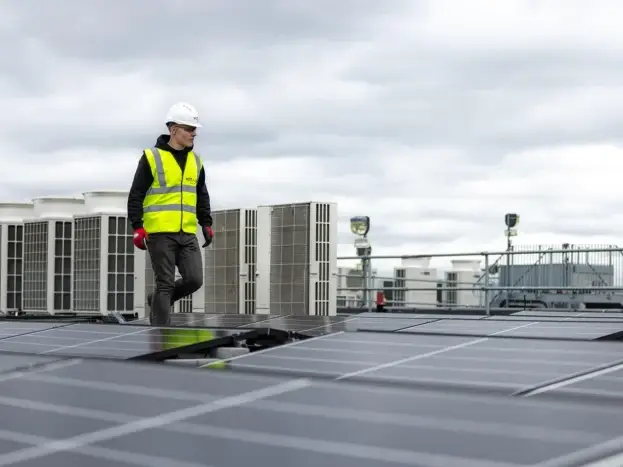 Construction Worker Installing Panel